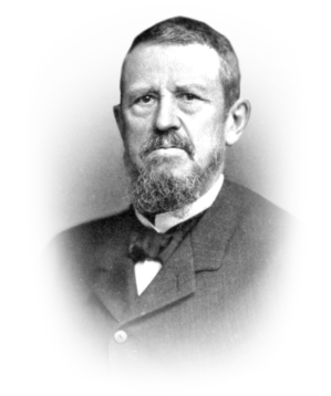 Historical Wharton 13290543264_vin A sepia-toned portrait of a person with a beard, wearing a suit with a bow tie, facing the camera.
